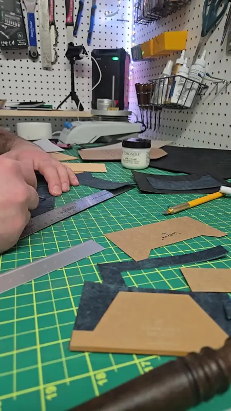Laying out panels on an indigo hide — Rogue Artisan leather workshop, East Vancouver
