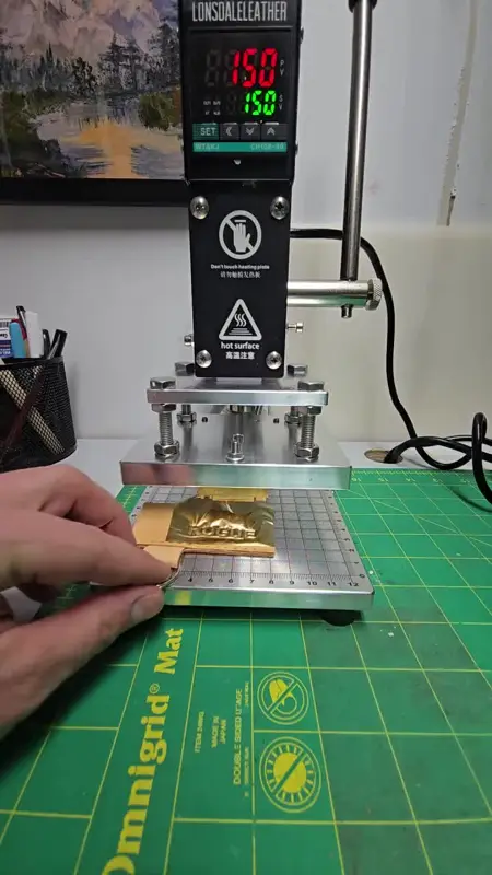 Hot-foil press at temperature — Rogue Artisan leather workshop, East Vancouver