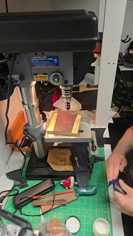 Setting up at the press — Rogue Artisan leather workshop, East Vancouver