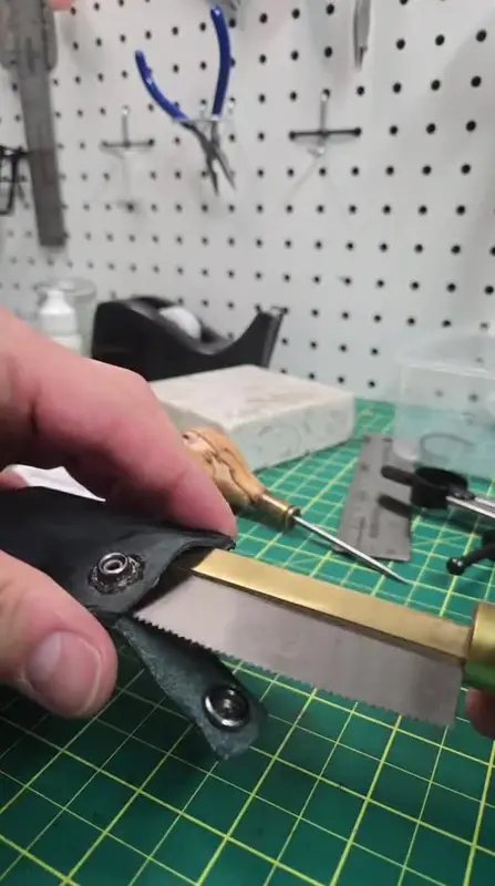Hardware going onto a key fob — Rogue Artisan leather workshop, East Vancouver
