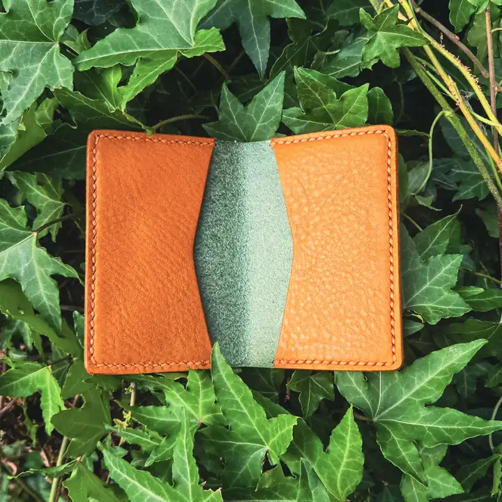 Orange and sage two-tone card holder in the ivy — Rogue Artisan, East Vancouver